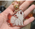 Porte-clé kitsune acrylique transparent avec mousqueton étoile doré